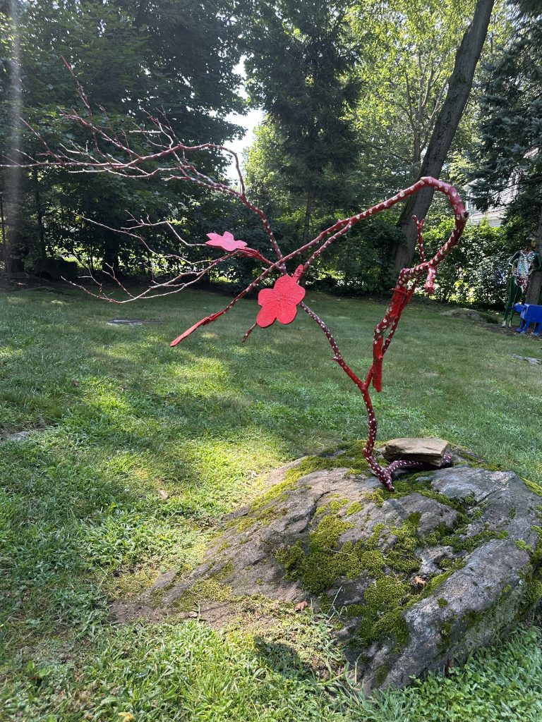 Red decorative branches on rock